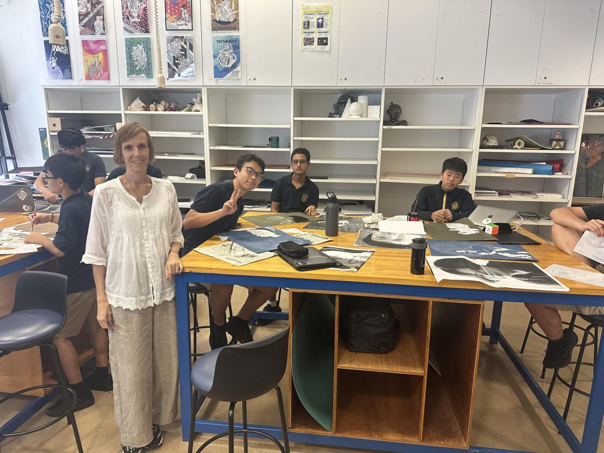 Mrs. Steel working with members of her art class