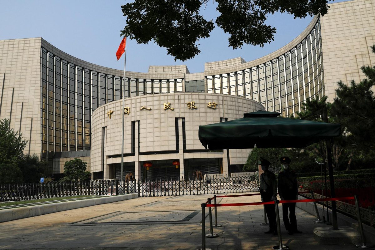 Paramilitary police officers stand guard in front of the headquarters of the People's Bank of China, the central bank (PBOC), in Beijing, China September 30, 2022. REUTERS/Tingshu Wang