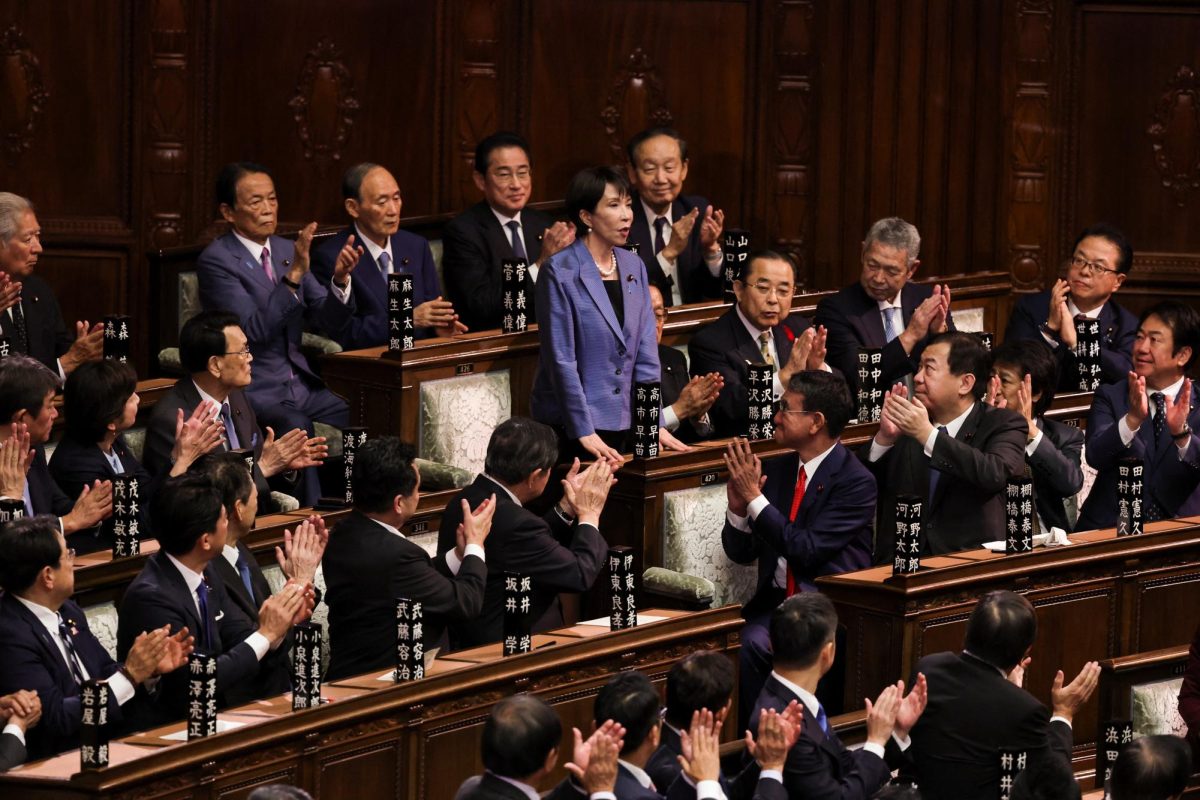 Leader of Japan's ruling Liberal Democratic Party (LDP) Sanae Takaichi reacts as she receives applause after being elected as prime minister, at the Lower House of Parliament in Tokyo, Japan October 21, 2025. REUTERS/Kim Kyung-Hoon