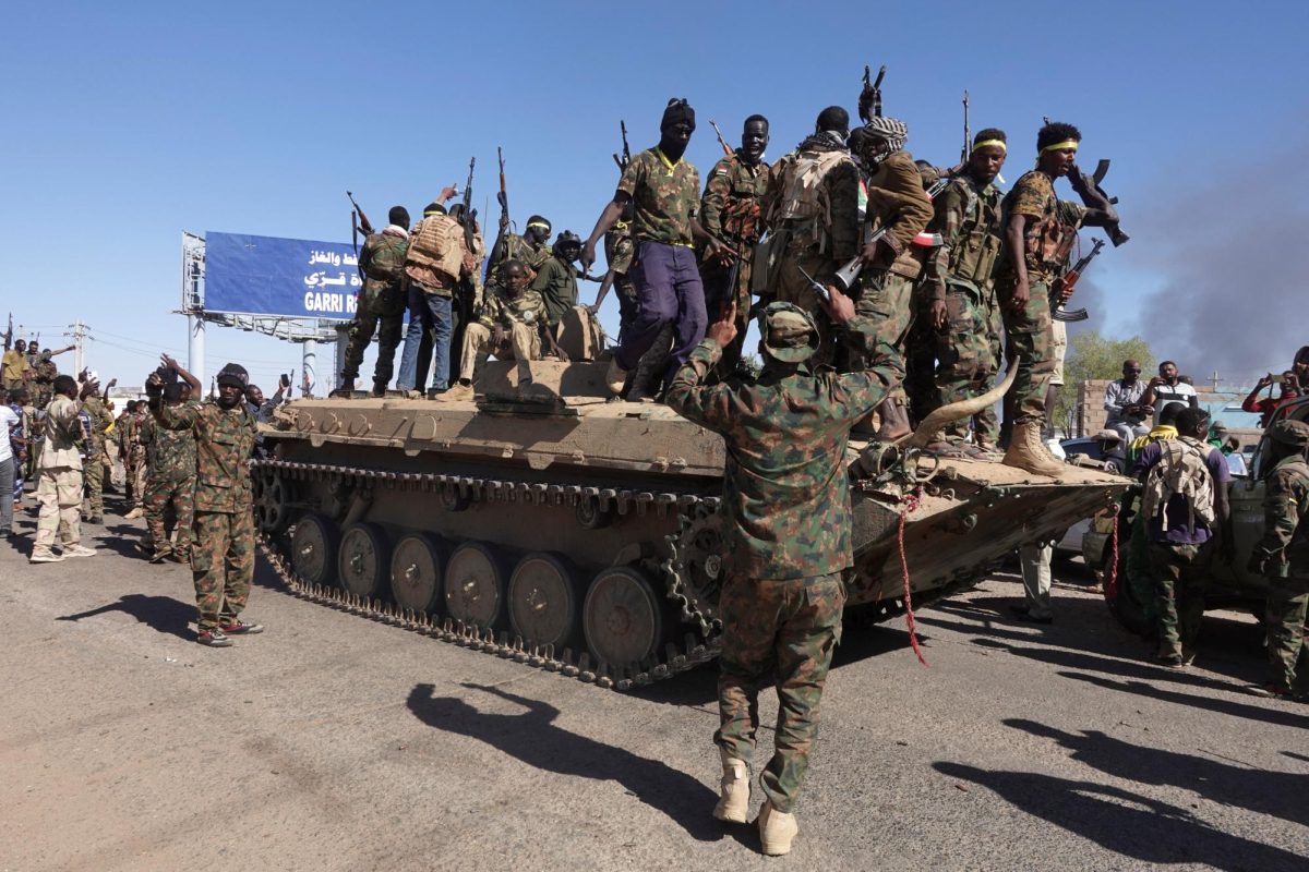 Sudan's army soldiers celebrate the army's liberation of an oil refinery, in North Bahri, Sudan, January 25, 2025. REUTERS/El Tayeb Siddig