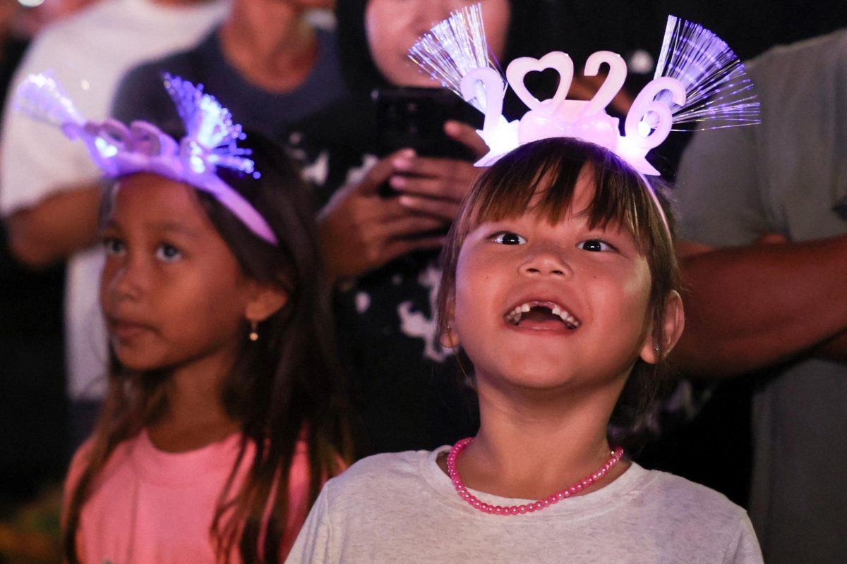 Children wearing '2026’ head bands attend the New Year's Eve celebrations in Jakarta, Indonesia, December 31, 2025. REUTERS/Ajeng Dinar Ulfiana