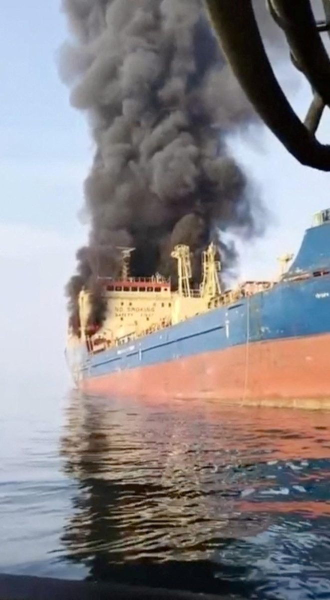 Smoke billows from an oil tanker under U.S. sanctions, that was hit off Oman's Musandam peninsula, in this screen grab from a video obtained by REUTERS on March 1, 2026.
