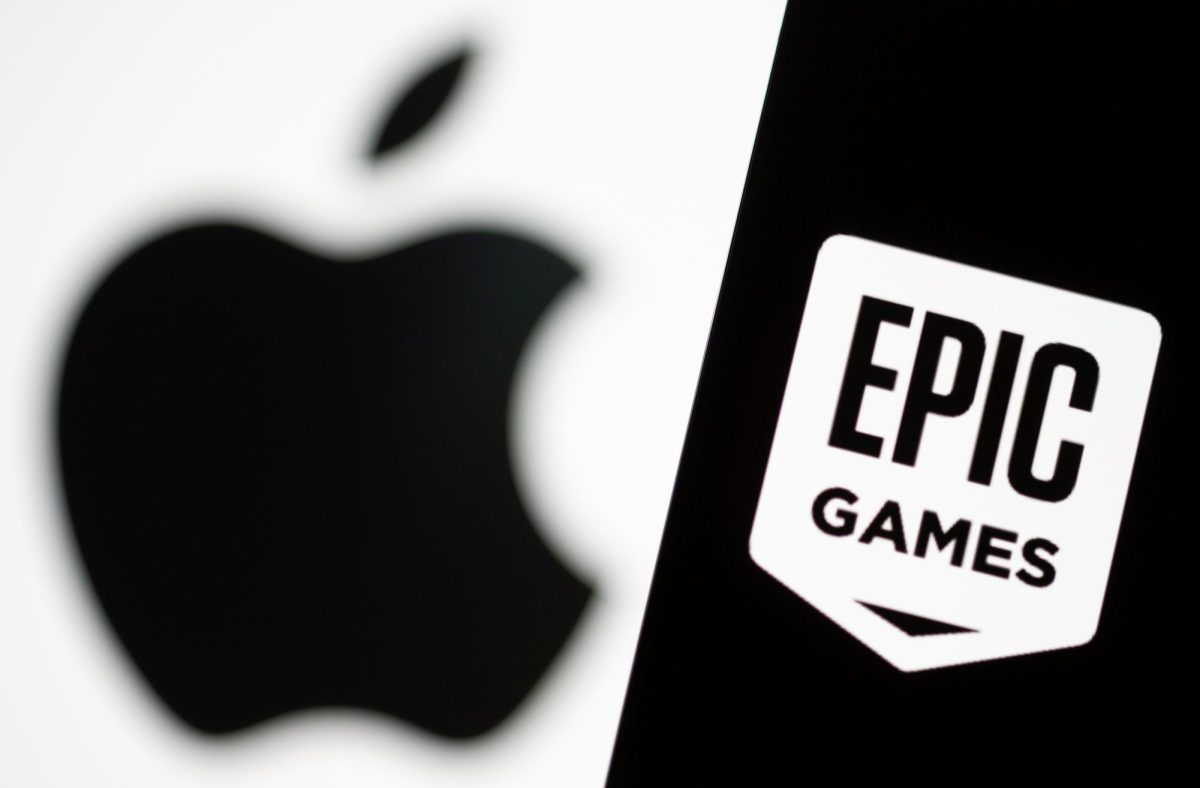 Smartphone with Epic Games logo is seen in front of Apple logo in this illustration taken, May 2, 2021. REUTERS/Dado Ruvic/Illustration