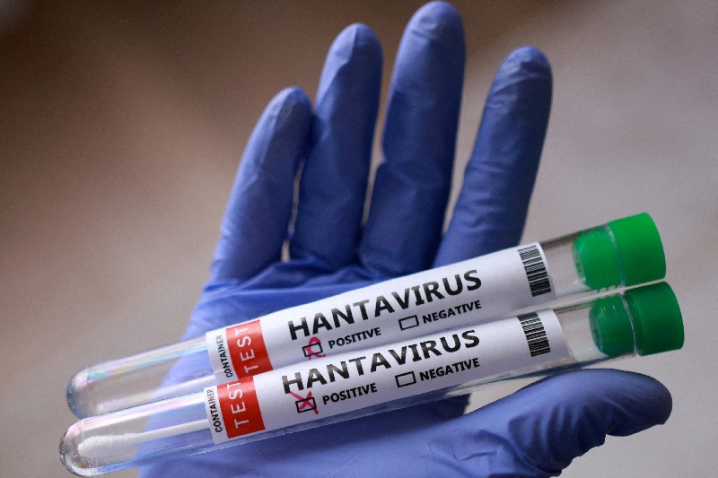 Test tubes labelled "Hantavirus positive" are held in this illustration taken May 7, 2026. REUTERS/Dado Ruvic/Illustration